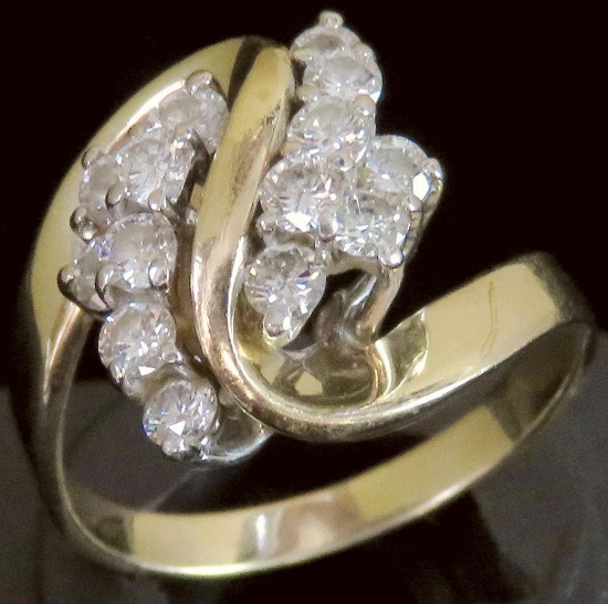 Ring tests 14K with (14) diamonds. Approx 4.8 grams.