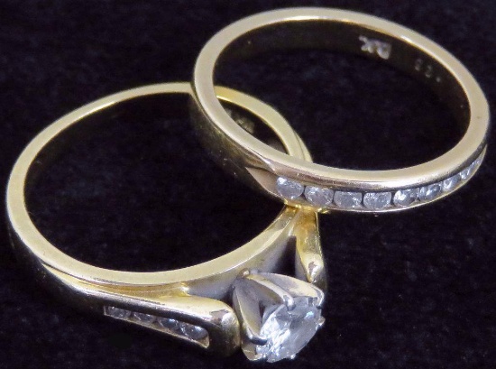 Wedding Ring and Band marked 14K. Wedding Ring has (9) diamonds (1) large and (4) on each side. Ba
