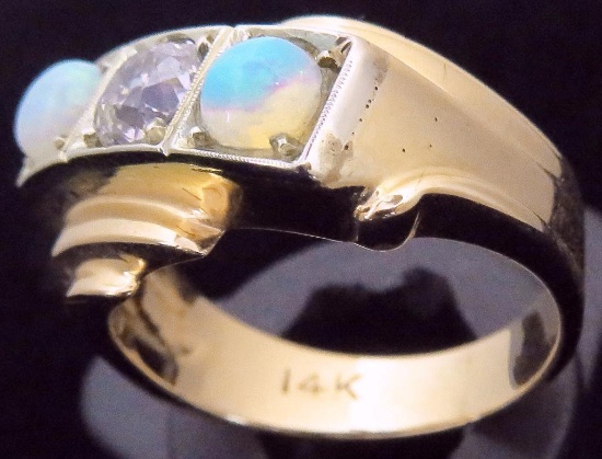 Ring marked 14K with (2) Opals & Diamond. Approx 9.2 grams.