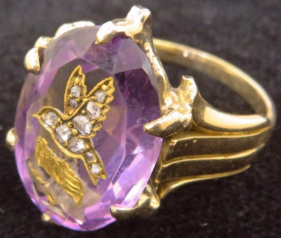 14K Ring with Oval Amethyst approx 4ct. with carved bird inlaid with (10) diamond chips. Approx 8.0