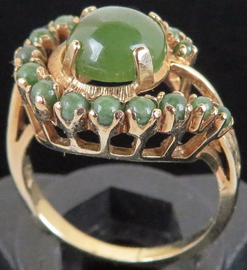Ring marked 10K with green stones. Approx 4.2 grams.