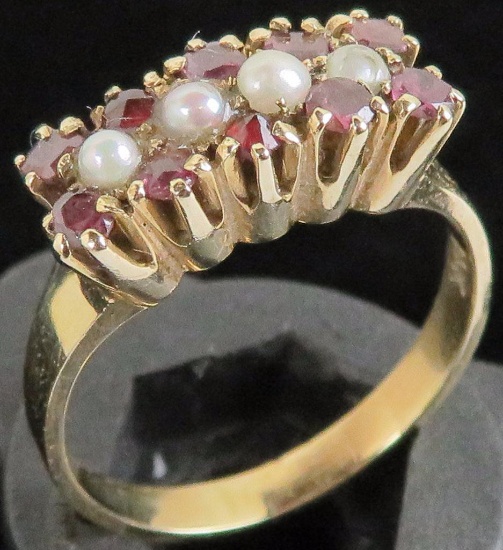 Ring marked 14K with red and white stones. Approx 3.8 grams.