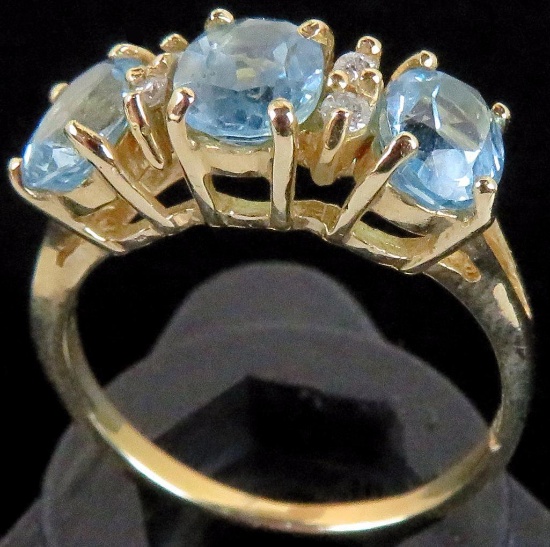 Ring marked 14K with blue & clear stones. Approx 3.6 grams.