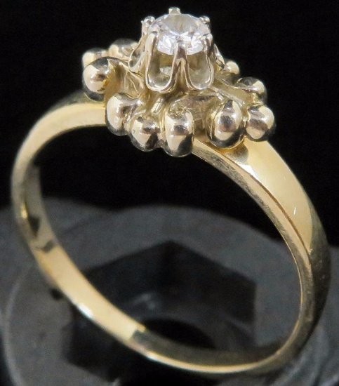 Ring marked 14K with clear stone. Approx 3.2 grams.
