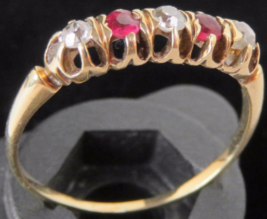 Ring tests 14K with red & clear stones. Approx 1.8 grams.