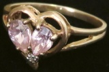 Ring marked 10K with pink & clear stones. Approx 2.7 grams.