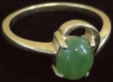 Ring tests 14K with green stone. Approx 2.4 grams.