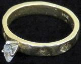 Ring marked 14K with clear stone. Approx 4.2 grams.