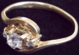 Ring marked 14K with clear stones. Approx 1.9 grams.