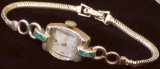 Antique Lady's Concord Watch Co. marked 14K - 17 Jewels with green stones - 334F. Approx 14.2 grams