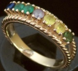 Ring marked 14K with multi colored stones. Approx 4.7 grams.