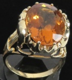 Ring marked 10K with orange stone. Approx 7.4 grams.