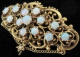 Antique Brooch / Pin marked 14K with (13) Opals. Approx 12.2 grams.