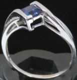 Ring marked 10K with blue & clear stones. Approx 2.4 grams.