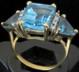 Ring tests 10K with blue & clear stones. Approx 4.5 grams.