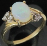 Ring marked 14K with opal & clear stones. Approx 2.0 grams.