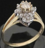 Ring marked 14K with (15) diamonds. Approx 2.8 grams.