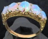 Antique 18K yellow gold Ring with (5) Opals & (10) diamond chips. Approx 4.6 grams.