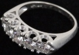 Lady's 14K white gold Anniversary Ring with (5) diamonds.