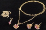 14K Set of (2) Necklaces and a pair of Earrings all with red stones. Approx 4.3 grams.