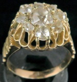 Cluster Ring tests 14K with (9) Old European cut diamonds. Approx 7.9 grams.