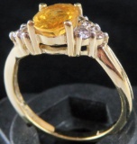Ring marked 14K with yellow and clear stones. Approx 2.8 grams.