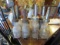 VINTAGE OIL RACK WITH ASSORTED 8 GLASS OIL BOTTLES