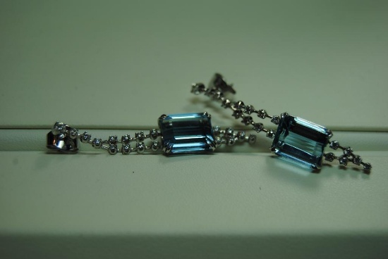 Diamond and Aquamarine dangle earrings.