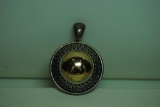 Silver and gold disc pendant.