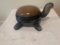 Black and sienna ceramic turtle with ?avanyu? motif and one turquoise eye
