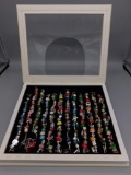 Set of Twelve Charming Year Bracelets in a wooden storage box