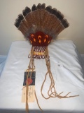 Fan made of feathers, beads, and hide