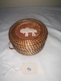 Sweet grass, bark and porcupine quill basket with a buffalo design on the bottom