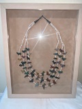 Triple beaded necklace with colored carved stone animals