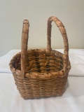 Woven basket with two handles