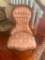 Vintage pink floral upholstered Victorian style parlor side chair with brass wheels