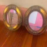 Two Oval Framed Mirrors
