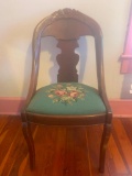 Wooden Chair w/ needlepoint cushion. Carved wood back