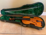 Very used violin barely there strings and very worn bow