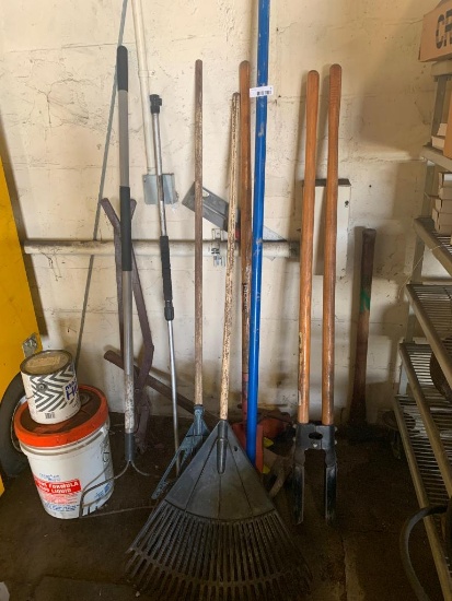 Misc lot of rakes, shovel, post hold digger, pick axe