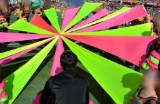 Three boxes of misc dance banners (pink, blue, green and yellow) 13' x 27'