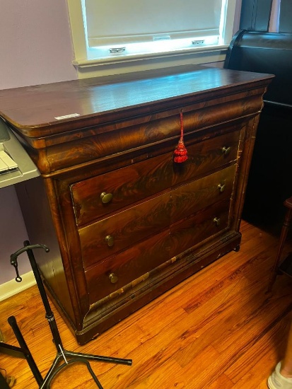 Dark wood four drawer chest