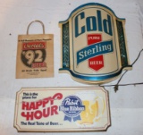 A Sterling Beer Lighted Sign, a Pabst Blue Ribbon Wood Sign, and an Oertels Six Pack Bag