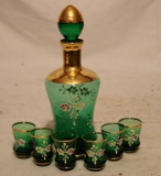 A Green and Gold Decorated Crystal Wine Set with Six Glasses