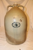 An Evansville Uhl Eight Gallon Stoneware Double Handled Jug with Bung Hole
