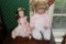 A Vintage Vinyl Doll, and a Porcelain Doll Marked Pat Secrest