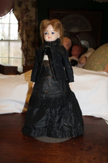 A Vintage Wax Head Doll with Cloth Body