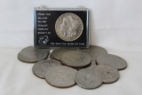 A 1921 Silver Dollar, 10 Ike Dollars, 2 Clad half Dollars