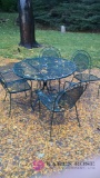 Metal patio table with four chairs