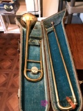 Conn trumpet in case